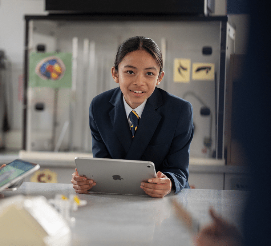 Student holding iPad